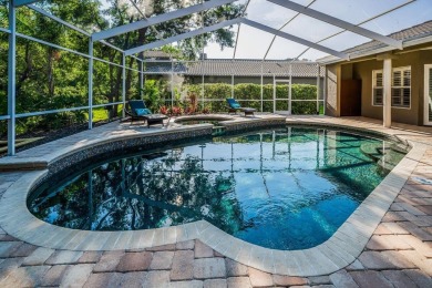 Under contract-accepting backup offers. Exquisite Luxury Retreat on Tarpon Woods Golf Club in Florida - for sale on GolfHomes.com, golf home, golf lot