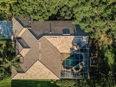 Under contract-accepting backup offers. Exquisite Luxury Retreat on Tarpon Woods Golf Club in Florida - for sale on GolfHomes.com, golf home, golf lot