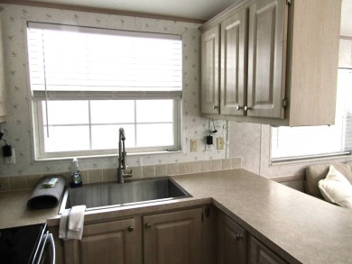 Welcome to your new DREAM HOME, located at 205 Arnold Palmer Dr on Deer Creek RV Golf Resort in Florida - for sale on GolfHomes.com, golf home, golf lot