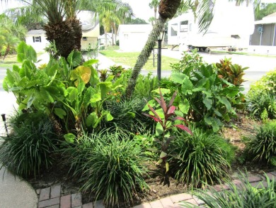 Welcome to your new DREAM HOME, located at 205 Arnold Palmer Dr on Deer Creek RV Golf Resort in Florida - for sale on GolfHomes.com, golf home, golf lot
