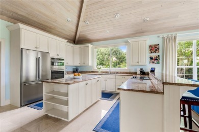 West Indies-inspired 3BR/3.5BA estate on .62 acres overlooking on Orchid Island Golf and Beach Club in Florida - for sale on GolfHomes.com, golf home, golf lot