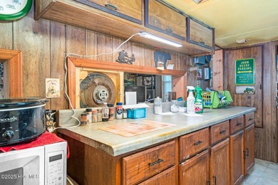 Escape to Lake Royale with this unique weekend retreat at 106 & on River Golf and Country Club at Lake Royale in North Carolina - for sale on GolfHomes.com, golf home, golf lot