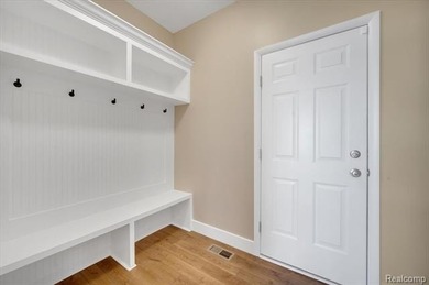 This beautifully appointed 5-bedroom, 4-bathroom home, built in on Boulder Pointe Golf Club and Conference Center in Michigan - for sale on GolfHomes.com, golf home, golf lot