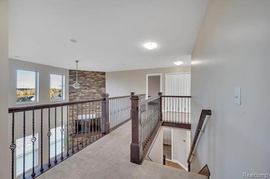 This beautifully appointed 5-bedroom, 4-bathroom home, built in on Boulder Pointe Golf Club and Conference Center in Michigan - for sale on GolfHomes.com, golf home, golf lot