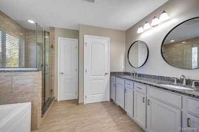 This beautifully appointed 5-bedroom, 4-bathroom home, built in on Boulder Pointe Golf Club and Conference Center in Michigan - for sale on GolfHomes.com, golf home, golf lot