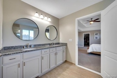 This beautifully appointed 5-bedroom, 4-bathroom home, built in on Boulder Pointe Golf Club and Conference Center in Michigan - for sale on GolfHomes.com, golf home, golf lot