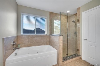 This beautifully appointed 5-bedroom, 4-bathroom home, built in on Boulder Pointe Golf Club and Conference Center in Michigan - for sale on GolfHomes.com, golf home, golf lot