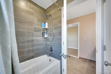 This beautifully appointed 5-bedroom, 4-bathroom home, built in on Boulder Pointe Golf Club and Conference Center in Michigan - for sale on GolfHomes.com, golf home, golf lot