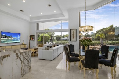 Enjoy sweeping lake and golf course views from this beautifully on Stonebridge Golf and Country Club in Florida - for sale on GolfHomes.com, golf home, golf lot