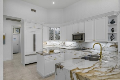 Enjoy sweeping lake and golf course views from this beautifully on Stonebridge Golf and Country Club in Florida - for sale on GolfHomes.com, golf home, golf lot