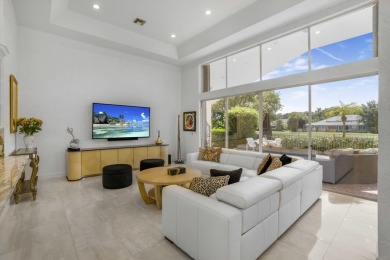 Enjoy sweeping lake and golf course views from this beautifully on Stonebridge Golf and Country Club in Florida - for sale on GolfHomes.com, golf home, golf lot