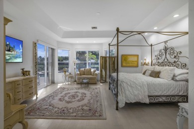 Enjoy sweeping lake and golf course views from this beautifully on Stonebridge Golf and Country Club in Florida - for sale on GolfHomes.com, golf home, golf lot