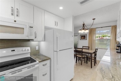 BEAUTIFULLY REMODELED, FIRST FLOOR 2 BEDROOM, 1.5 BATH CONDO on Hillsboro Pines Golf in Florida - for sale on GolfHomes.com, golf home, golf lot