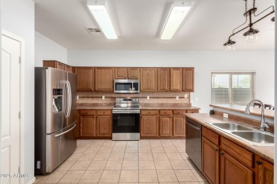 Discover the perfect blend of comfort, space, and resort-style on The Golf Club At Johnson Ranch in Arizona - for sale on GolfHomes.com, golf home, golf lot
