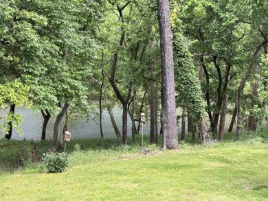 A great location overlooking the South Fork River next to the on Cherokee Village North Course in Arkansas - for sale on GolfHomes.com, golf home, golf lot