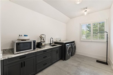 The epitome of right-sized luxury living awaits in this on Hawks Ridge Golf Club in Georgia - for sale on GolfHomes.com, golf home, golf lot