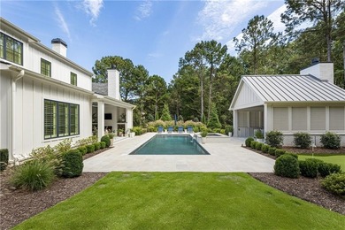 The epitome of right-sized luxury living awaits in this on Hawks Ridge Golf Club in Georgia - for sale on GolfHomes.com, golf home, golf lot