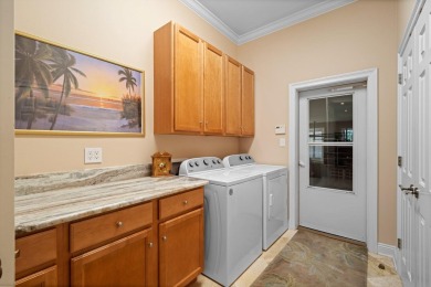 Boating enthusiasts, look no further! Timeless beauty right off on Regatta Bay Golf and Country Club in Florida - for sale on GolfHomes.com, golf home, golf lot