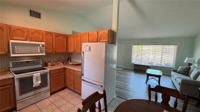 Charming and updated 2-bedroom, 1-bath, 1-car garage home on an on Duffys Golf Center in Florida - for sale on GolfHomes.com, golf home, golf lot