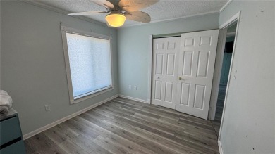 Charming and updated 2-bedroom, 1-bath, 1-car garage home on an on Duffys Golf Center in Florida - for sale on GolfHomes.com, golf home, golf lot