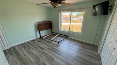 Charming and updated 2-bedroom, 1-bath, 1-car garage home on an on Duffys Golf Center in Florida - for sale on GolfHomes.com, golf home, golf lot