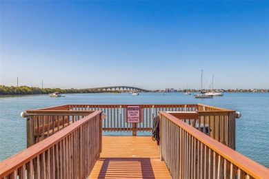 Private, waterfront living in this 2-bedroom, 2-bath corner on Isla Del Sol Yacht and Country Club in Florida - for sale on GolfHomes.com, golf home, golf lot