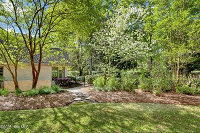 Experience refined living in this beautifully maintained brick on Country Club of Landfall in North Carolina - for sale on GolfHomes.com, golf home, golf lot