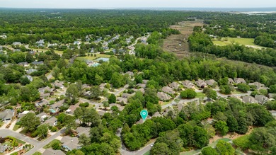 Experience refined living in this beautifully maintained brick on Country Club of Landfall in North Carolina - for sale on GolfHomes.com, golf home, golf lot