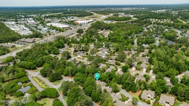 Experience refined living in this beautifully maintained brick on Country Club of Landfall in North Carolina - for sale on GolfHomes.com, golf home, golf lot