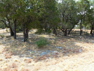 Nice corner lot on a cul-de-sac has distant lake views from the on Summit Rock Golf Course in Texas - for sale on GolfHomes.com, golf home, golf lot