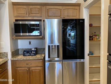 2713 Plaza Verde is a home beyond ordinary! Premier Residential on London Bridge Golf Course in Arizona - for sale on GolfHomes.com, golf home, golf lot