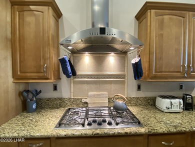 2713 Plaza Verde is a home beyond ordinary! Premier Residential on London Bridge Golf Course in Arizona - for sale on GolfHomes.com, golf home, golf lot