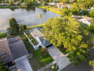 Experience waterfront luxury living in this fully renovated on Bloomingdale Golfers Club in Florida - for sale on GolfHomes.com, golf home, golf lot