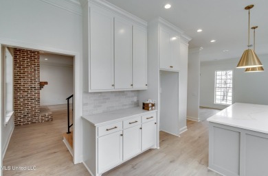 Welcome to this elegant 6-bedroom, 4.5-bathroom home with a on Colonial Country Club Deerfield in Mississippi - for sale on GolfHomes.com, golf home, golf lot