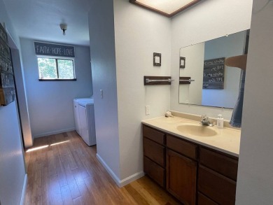 This beautiful home sits directly on the golf course in a quiet on Discovery Harbour Golf Course in Hawaii - for sale on GolfHomes.com, golf home, golf lot