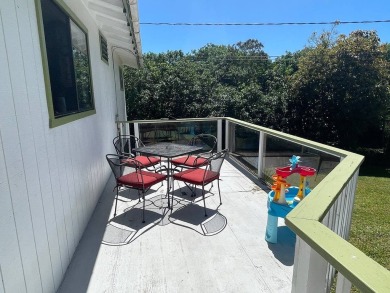 This beautiful home sits directly on the golf course in a quiet on Discovery Harbour Golf Course in Hawaii - for sale on GolfHomes.com, golf home, golf lot