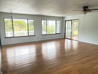 This beautiful home sits directly on the golf course in a quiet on Discovery Harbour Golf Course in Hawaii - for sale on GolfHomes.com, golf home, golf lot