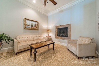 This Florida-style, hard stucco home is a beautiful ranch home on Trump National Golf Club Charlotte in North Carolina - for sale on GolfHomes.com, golf home, golf lot