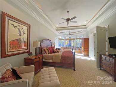 This Florida-style, hard stucco home is a beautiful ranch home on Trump National Golf Club Charlotte in North Carolina - for sale on GolfHomes.com, golf home, golf lot