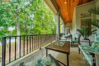 This Florida-style, hard stucco home is a beautiful ranch home on Trump National Golf Club Charlotte in North Carolina - for sale on GolfHomes.com, golf home, golf lot