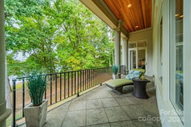 This Florida-style, hard stucco home is a beautiful ranch home on Trump National Golf Club Charlotte in North Carolina - for sale on GolfHomes.com, golf home, golf lot