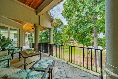 This Florida-style, hard stucco home is a beautiful ranch home on Trump National Golf Club Charlotte in North Carolina - for sale on GolfHomes.com, golf home, golf lot