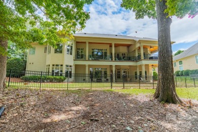 This Florida-style, hard stucco home is a beautiful ranch home on Trump National Golf Club Charlotte in North Carolina - for sale on GolfHomes.com, golf home, golf lot