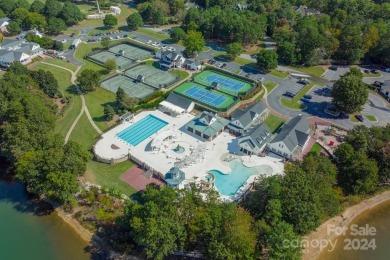 This Florida-style, hard stucco home is a beautiful ranch home on Trump National Golf Club Charlotte in North Carolina - for sale on GolfHomes.com, golf home, golf lot