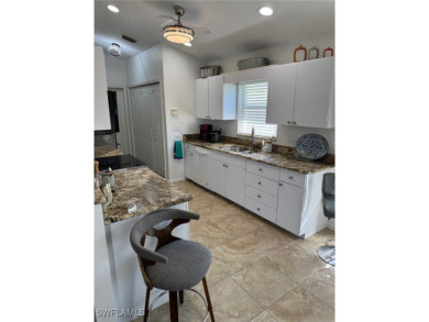 This is an amazing pool home nestled safely inside the gated 55+ on Sabal Springs Golf and Racquet Club in Florida - for sale on GolfHomes.com, golf home, golf lot