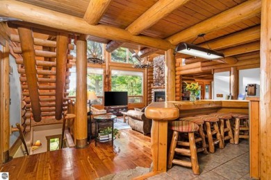 Welcome to this stunning Up North luxury log home perfectly on Boyne Mountain Resort - Monument Course in Michigan - for sale on GolfHomes.com, golf home, golf lot