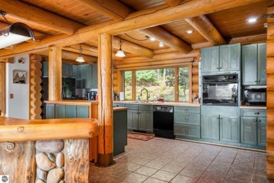 Welcome to this stunning Up North luxury log home perfectly on Boyne Mountain Resort - Monument Course in Michigan - for sale on GolfHomes.com, golf home, golf lot