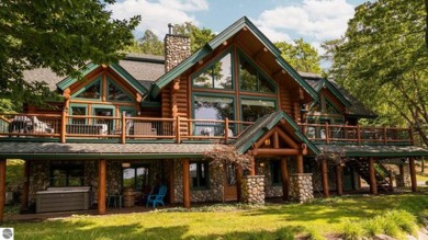 Welcome to this stunning Up North luxury log home perfectly on Boyne Mountain Resort - Monument Course in Michigan - for sale on GolfHomes.com, golf home, golf lot