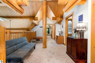 Welcome to this stunning Up North luxury log home perfectly on Boyne Mountain Resort - Monument Course in Michigan - for sale on GolfHomes.com, golf home, golf lot