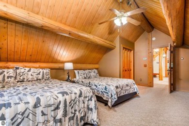 Welcome to this stunning Up North luxury log home perfectly on Boyne Mountain Resort - Monument Course in Michigan - for sale on GolfHomes.com, golf home, golf lot